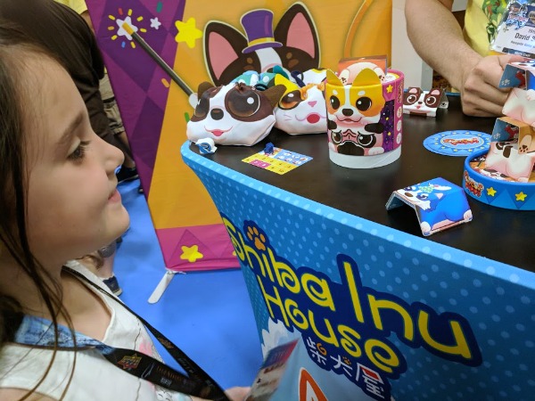 My daughter learning how to play Circus Puppy at Origins Game Fair