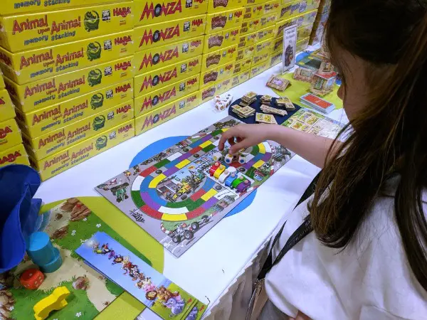 My daughter looking at the Monza demo game at HABA's booth.