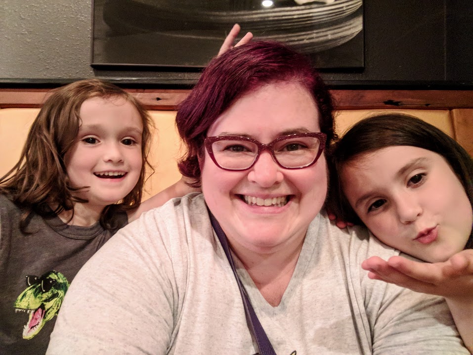 Darcy taking a selfie with her kids.