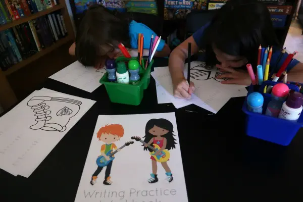 My kids practicing writing skills using the sight words printable sheets during our at home writing center.