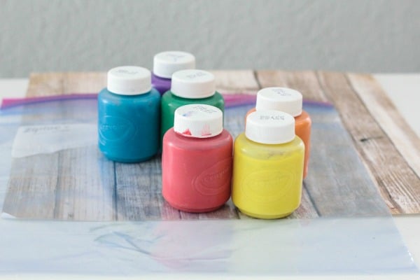 Supplies you need to make a rainbow writing bag for kids.