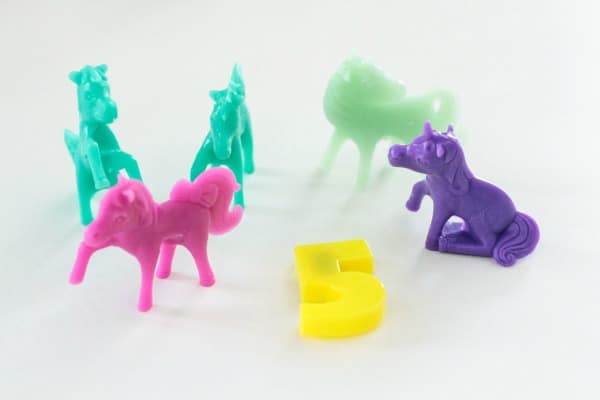 Show your child how to count out the unicorn toys to match the number.