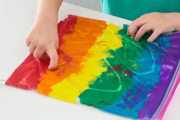 Kids can trace letters, numbers, and draw with this mess-free rainbow bag of paint.