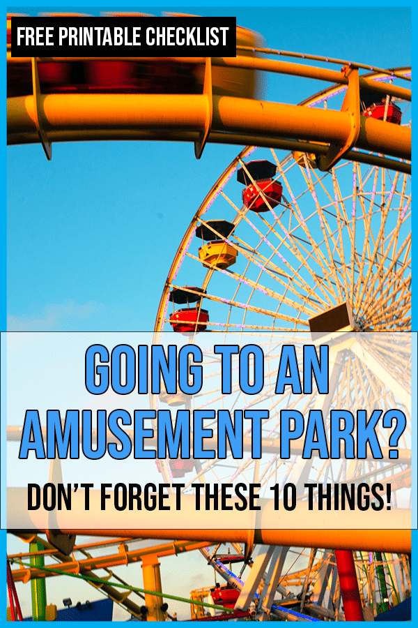 Ferris wheel and roller coaster track at an amusement park.