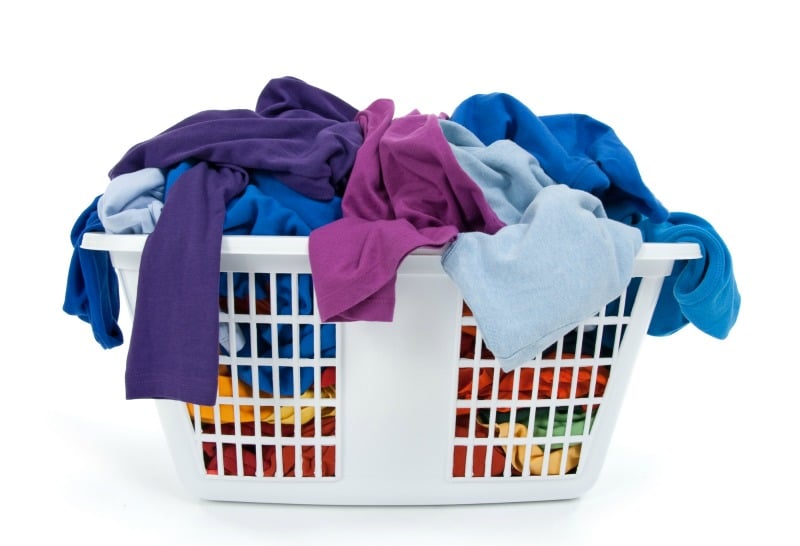White laundry basket full of clothes