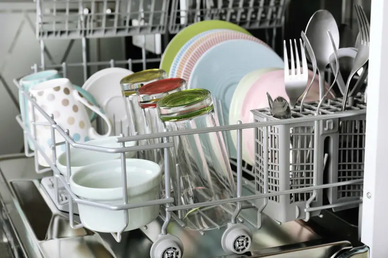 Clean glasses and dishes in dishwasher