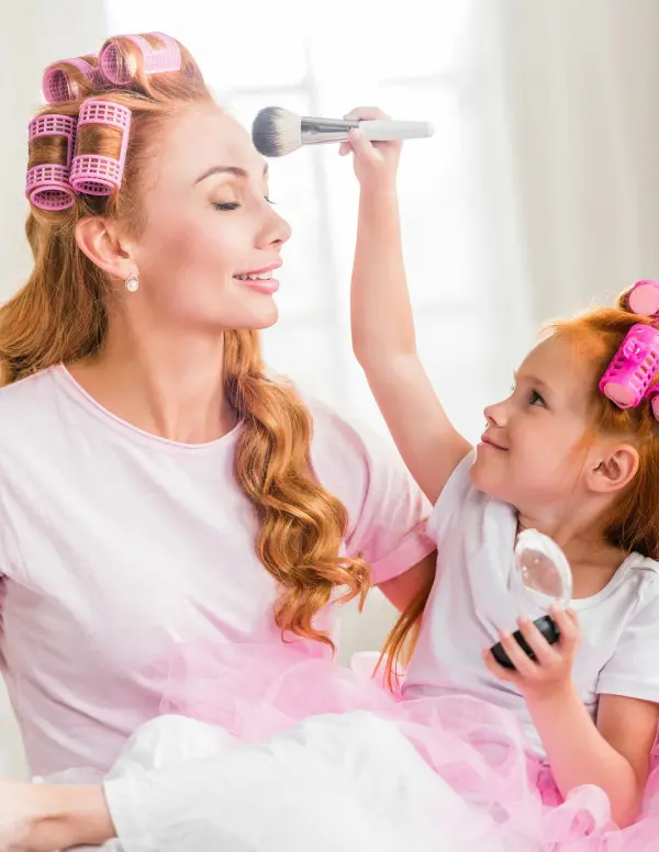 Mom and daughter playing dress up together