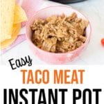 Cooked taco meat in pink bowl by taco shells and Instant Pot