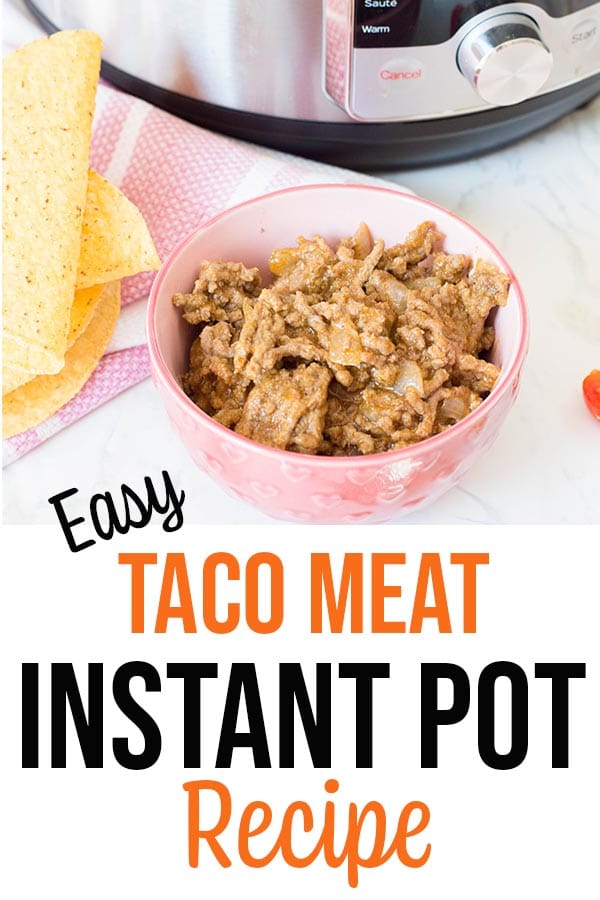 Cooked taco meat in pink bowl by taco shells and Instant Pot