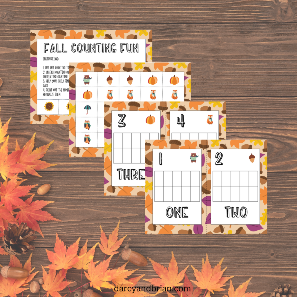 Digital mockup of some of the fall counting mats and printable tokens on a background of a dark wood table and leaves.