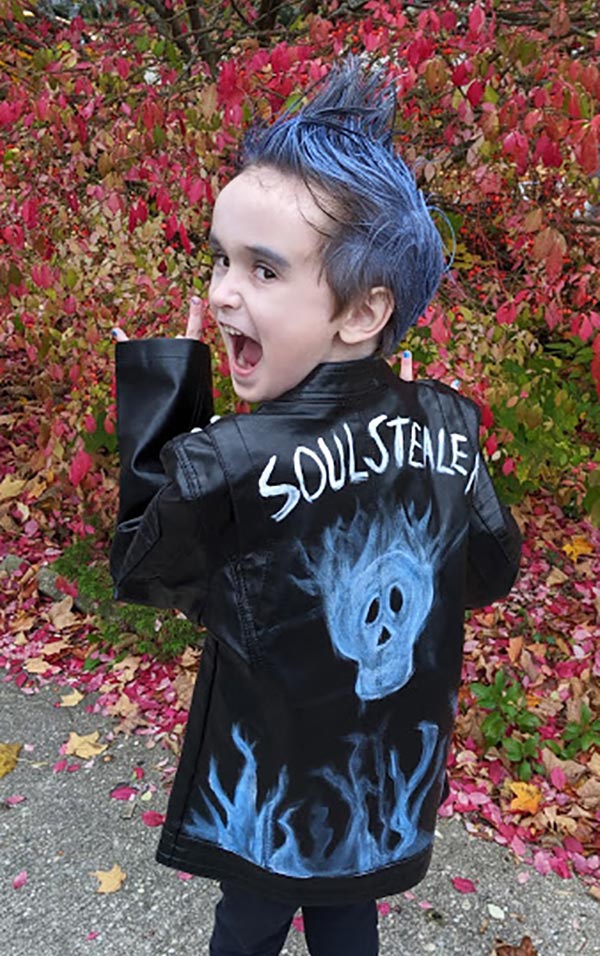 Boy looking over his shoulder and dressed up like Hades Descendants 3 character.