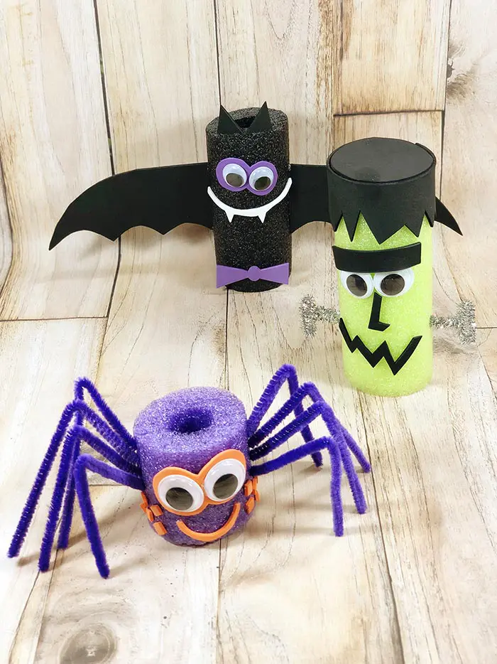 Completed spider, bat, and Frankenstein Halloween decorations made out of pool noodles