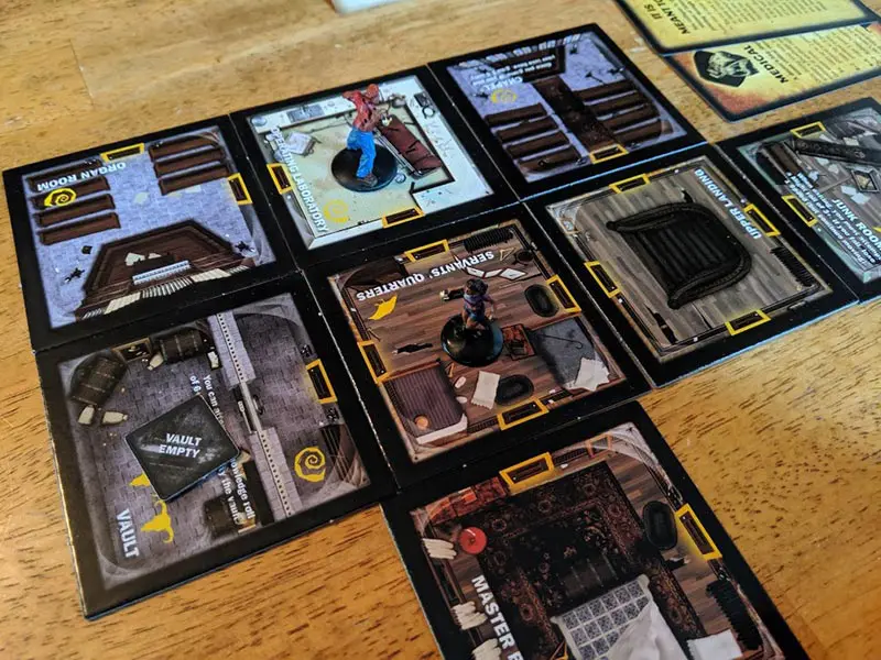 Room cards on table for playing Betrayal at House on the Hill.