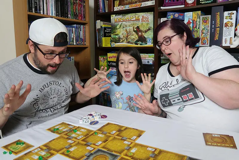 Family playing Escape Curse of the Temple board game.