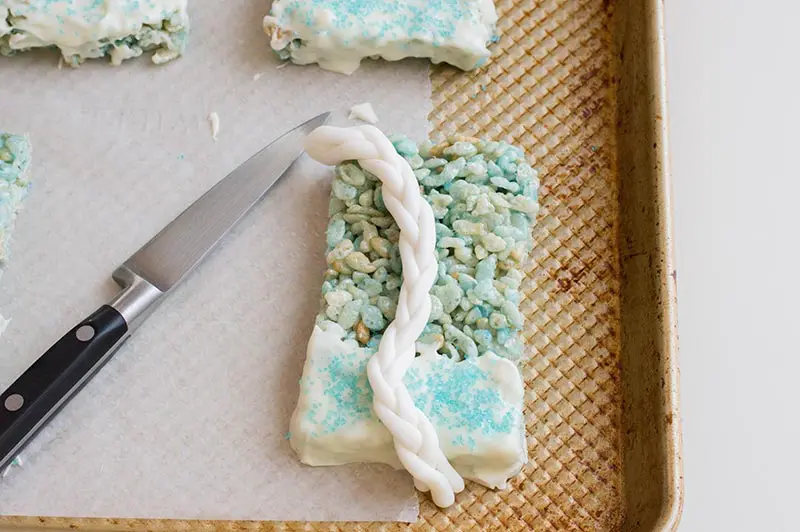 Place fondant braid on rice crispy treat on baking sheet.