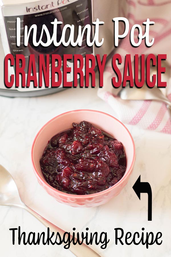Bowl of cranberry sauce on white counter next to pressure cooker with text overlay.