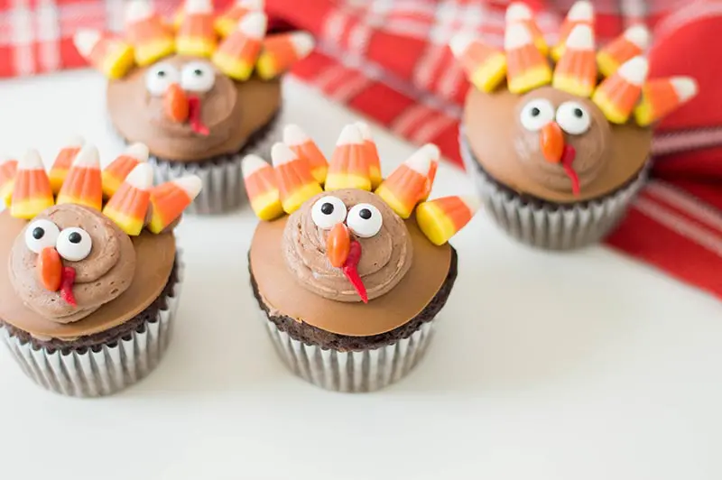 Close up of decorated turkey cupcakes.