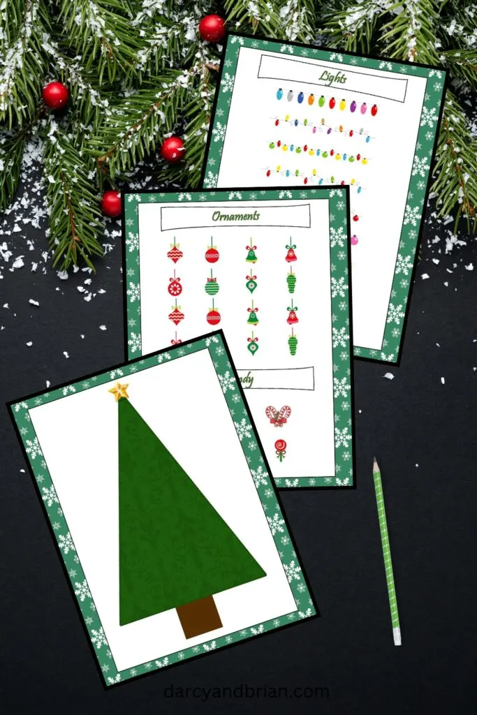 Mockup preview of printable decorate a Christmas tree game. Shows the tree game mat and decorations to cut out and place on the tree.