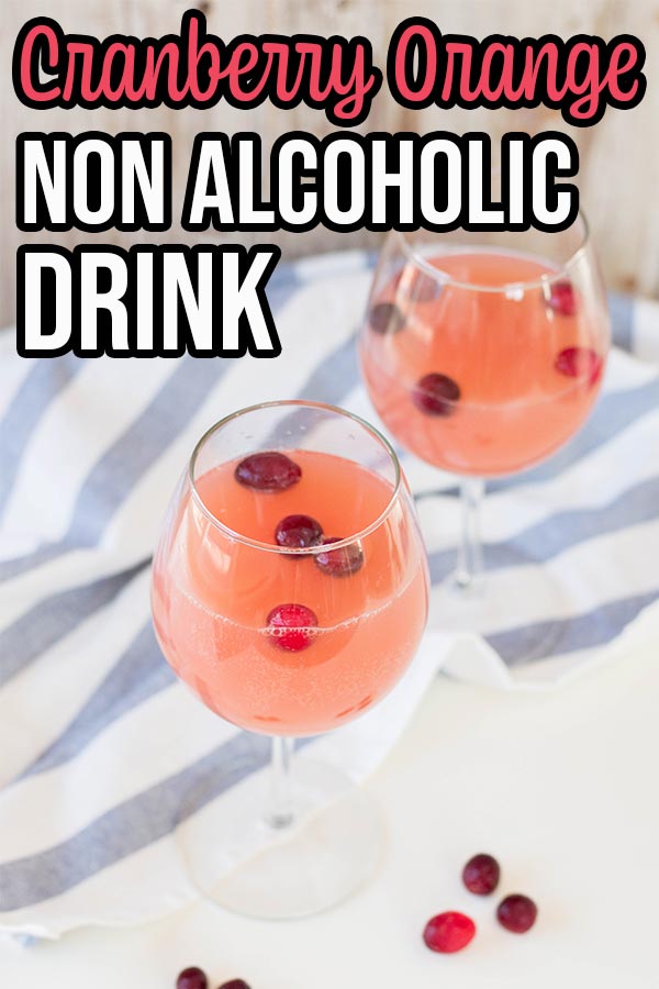 Sparkling cranberry orange drink in wine glasses with text overlay.