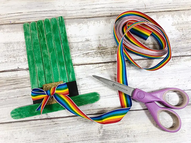 Rainbow striped ribbon tied in a bow and added to leprechaun hat.