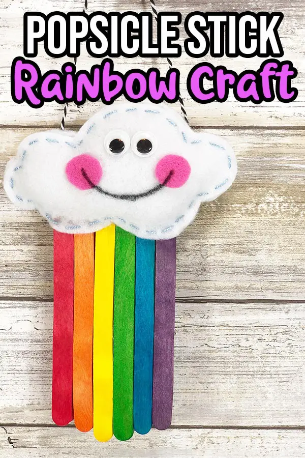 Finished popsicle stick rainbow with felt cloud decoration.