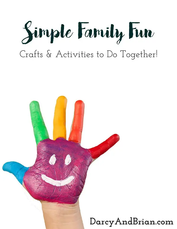 Preview of ebook cover. White background with black text that says Simple Family Fun Crafts & Activities to Do Together! And a child's hand covered in colorful paint with a smiley face on their palm.