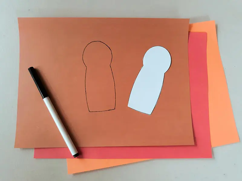 Used turkey body template to trace shape onto brown construction paper.