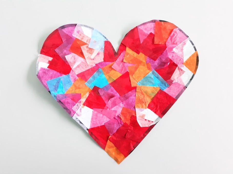 Heart shaped tissue paper suncatcher cut out from printable template.