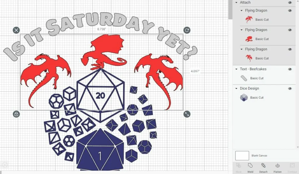 Screenshot within Cricut Design Space showing three dragon designs selected, color red, and attached. Dice sets design is in blue underneath the dragons. Above dragons curved text reads Is it Saturday yet? in gray.