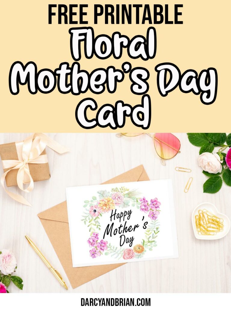 Black and white text on light yellow background reads Free Printable Floral Mother's Day Card. Below text is a preview of the floral Mother's Day card laying over an envelope. Flowers, gold pen, gold paper clips, sunglasses, and a small gift arranged around the card mockup.