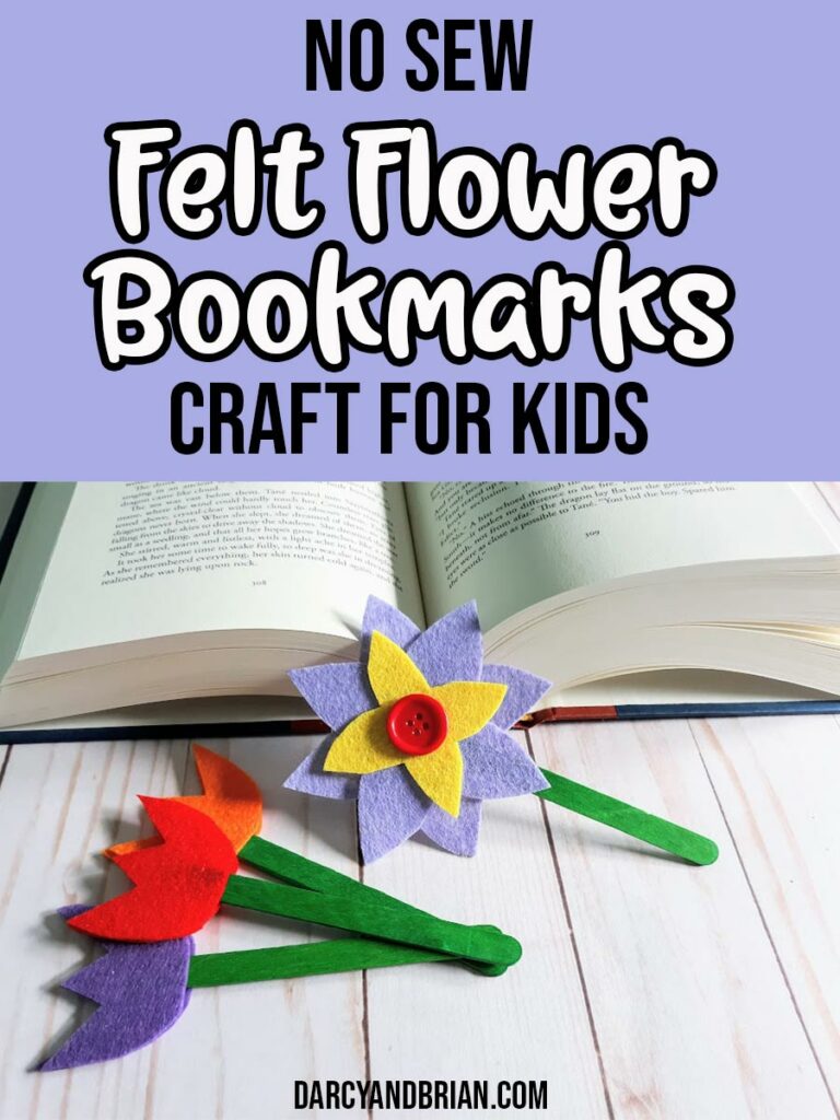 Black and white text on dark lavender background reads No Sew Felt Flower Bookmarks Craft For Kids. Bottom half of image shows an open hardcover book with a felt flower bookmark leaning against it and three felt tulip bookmarks laying down.
