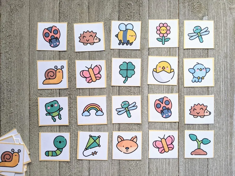 Spring themed matching cards cut out and laid out face up in 4x5 rectangle.