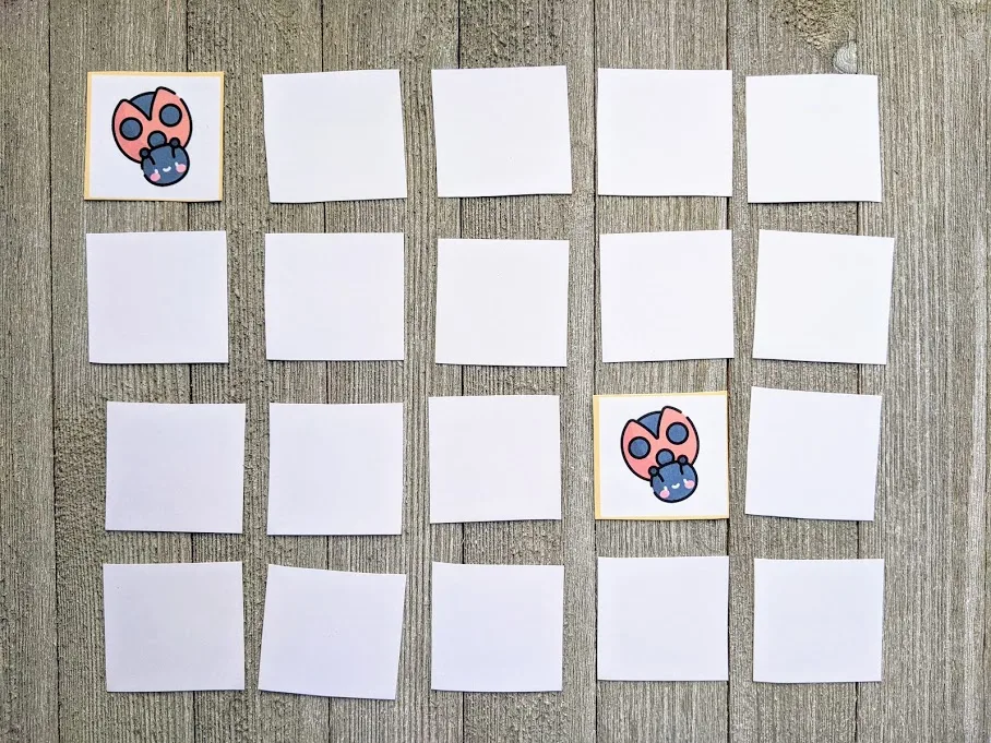 Spring memory match game cards laid out in 4x5 grid face down. Two cards with ladybugs are flipped over.
