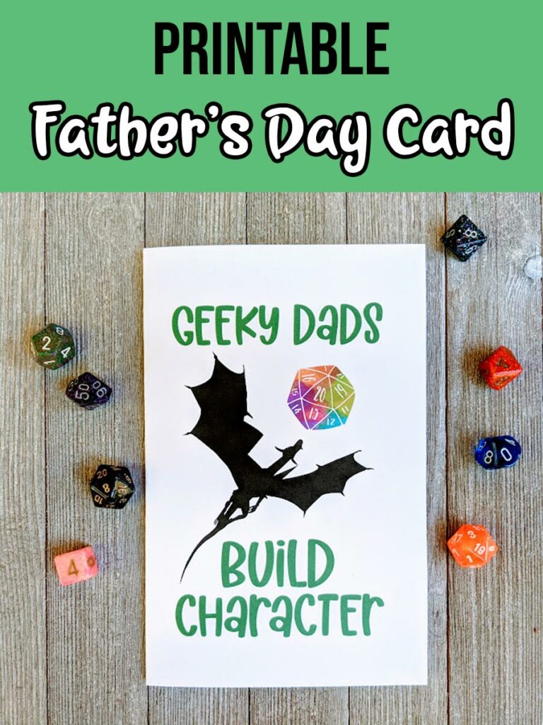 Black and white text on a green background at top says Printable Father's Day Card. Photo of printed out card that says Geeky Dads Build Character with a dragon and watercolor D20. Assorted dice are placed around the card.