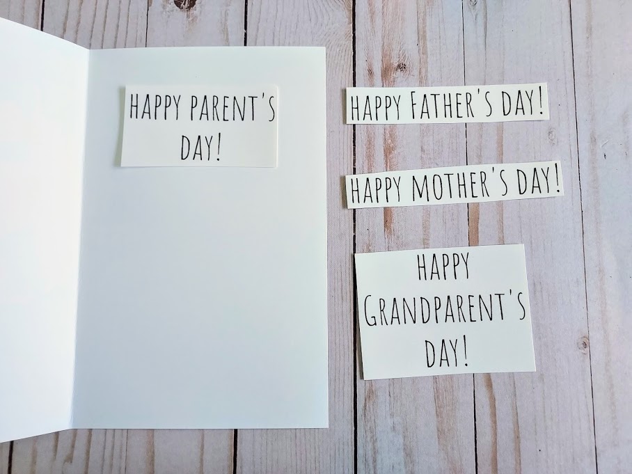 Happy Parent's Day positioned inside printable card. Other phrases have been cut out and lay next to the card. They say Happy Father's Day, Happy Mother's Day, and Happy Grandparent's Day.