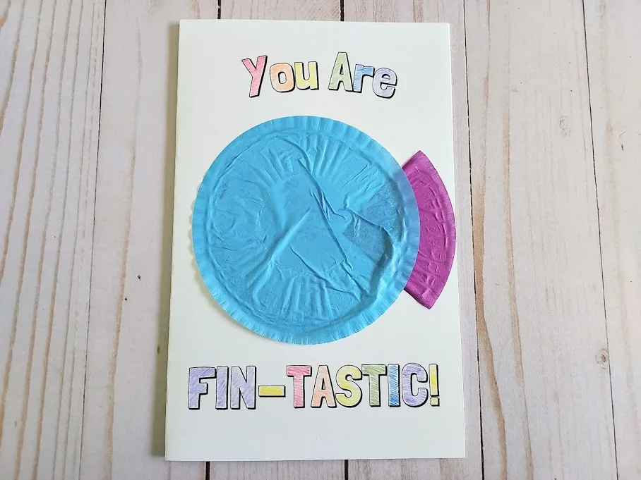 Flattened blue cupcake liner glued onto card for fish body.