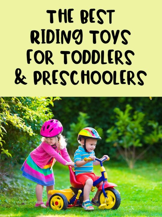Black text on light yellow background says The Best Riding Toys for Toddlers & Preschoolers. Below is a photo of white siblings preschool aged wearing helmets and playing with a tricycle on a green lawn.
