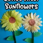 White text with black outline says Coffee Filter Sunflowers above two completed coffee filter sunflower crafts glued to blue construction paper with green pipe cleaner stems.