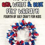 A picture of a felt wreath made with red, white, dark blue, and light blue felt strips hanging against an off white brick wall. Above wreath text in black, red, white, and blue says No Sew Red, White & Blue Felt Wreath Fourth of July Craft for Kids.