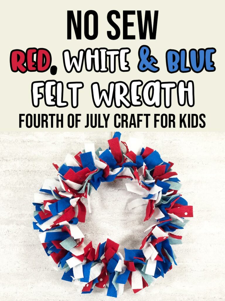 A picture of a felt wreath made with red, white, dark blue, and light blue felt strips hanging against an off white brick wall. Above wreath text in black, red, white, and blue says No Sew Red, White & Blue Felt Wreath Fourth of July Craft for Kids.