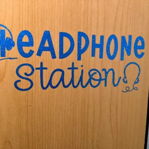 Blue glitter vinyl applied to side of wooden cabinet using the Headphone Station design from this project tutorial.