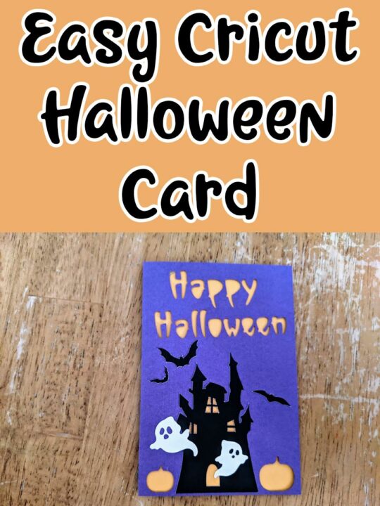 Black text outlined in white on an orange background reads Easy Cricut Halloween Card. Below text is an overhead view of a completed Halloween card made with purple and orange cardstock decorated with haunted house silhouette, bats, and white ghosts.