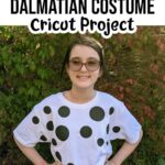 White tween girl wearing white tshirt with various black spots ironed on and black headband with black felt dog ears. Above picture is black text on white background that says DIY Dalmatian Costume Cricut Project.