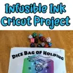 Blue text on white background at top says DIY Dice Bag Infusible Ink Cricut Project above picture of completed zippered cosmetics bag with rainbow colored hexagon on it and black iron on Dice Bag of Holding with an outline of two hands with a dice set between them. Assorted dice are spilling out of the bag onto a wooden table.