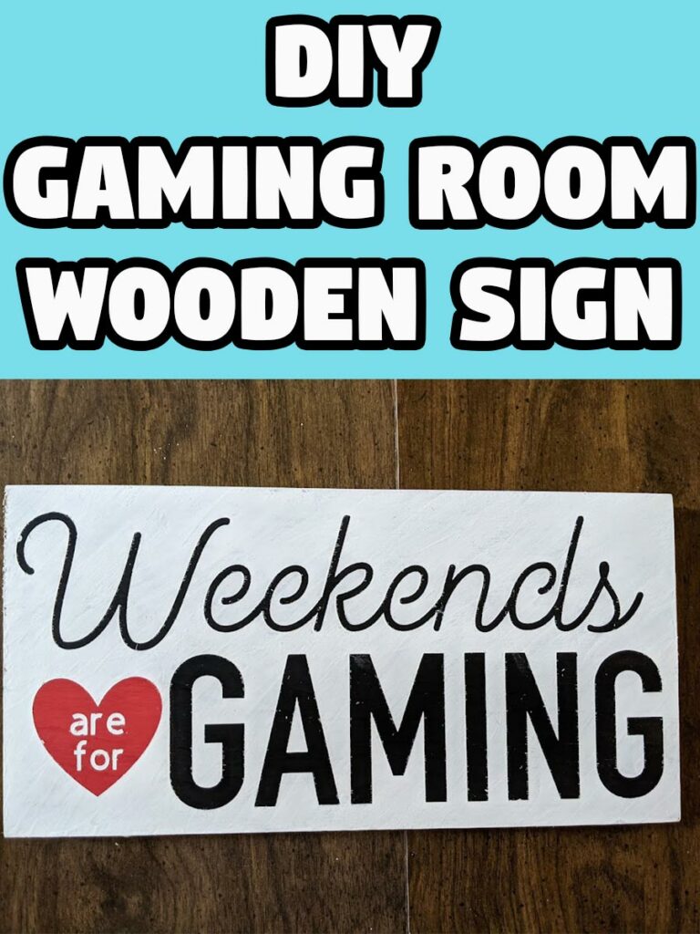 White text with black outline on bright cyan background reads DIY Gaming Room Wooden Sign. Below is picture of a wood sign painted white with black lettering and a red heart that says Weekends are for Gaming.