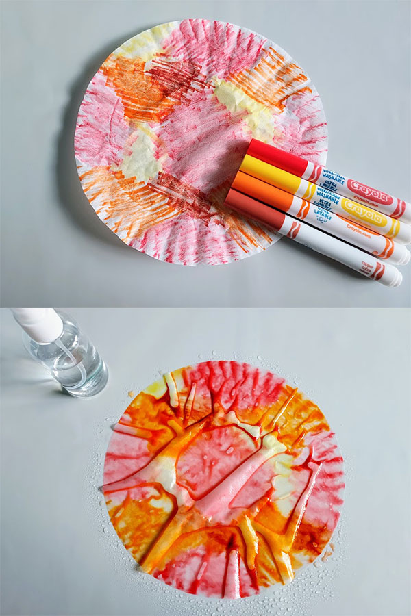 Top image shows coffee filter colored with red, yellow, and orange markers. Markers laying over part of colored coffee filter. Bottom image shows colored coffee filter sprayed with water to blend.