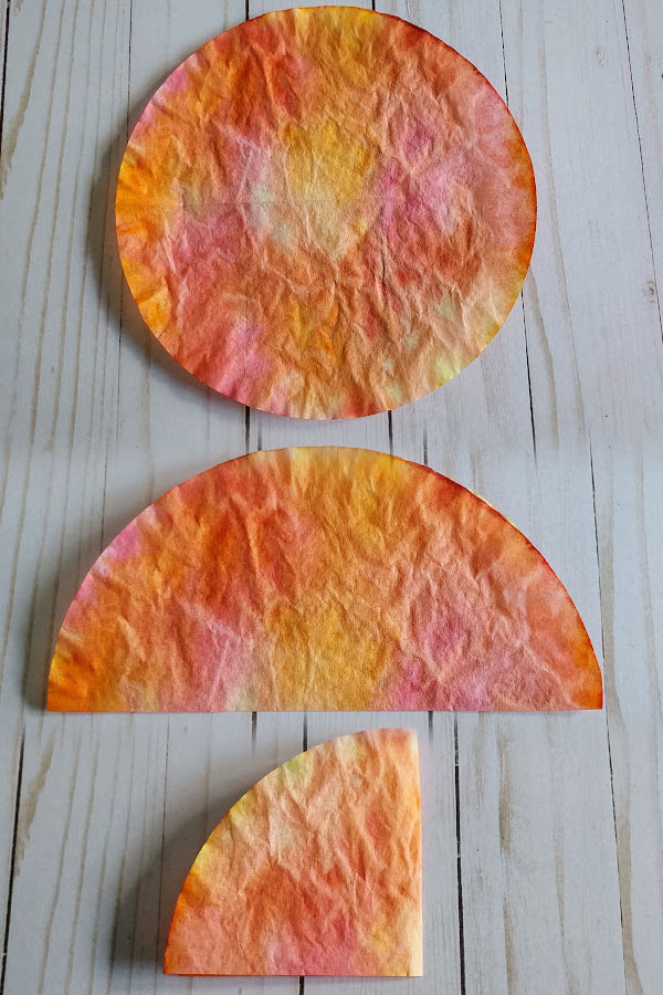 Image collage showing how to fold the coffee filters in half twice.