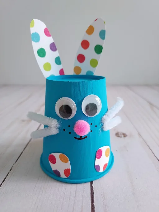 Close view of completed blue paper cup bunny craft.