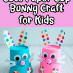 White text outlined in black on pink background reads Cute Paper Cup Bunny Craft for Kids. Below text are two bunnies made from upside down paper cups. Left one is painted blue and right one is painted pink. Googly eyes, pink pom pom noses, white pipe cleaner whiskers with mouth drawn in black marker. Ears and feet are cut from multi colored polka dotted patterned cardstock and glued to cup.