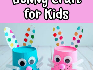 White text outlined in black on pink background reads Cute Paper Cup Bunny Craft for Kids. Below text are two bunnies made from upside down paper cups. Left one is painted blue and right one is painted pink. Googly eyes, pink pom pom noses, white pipe cleaner whiskers with mouth drawn in black marker. Ears and feet are cut from multi colored polka dotted patterned cardstock and glued to cup.